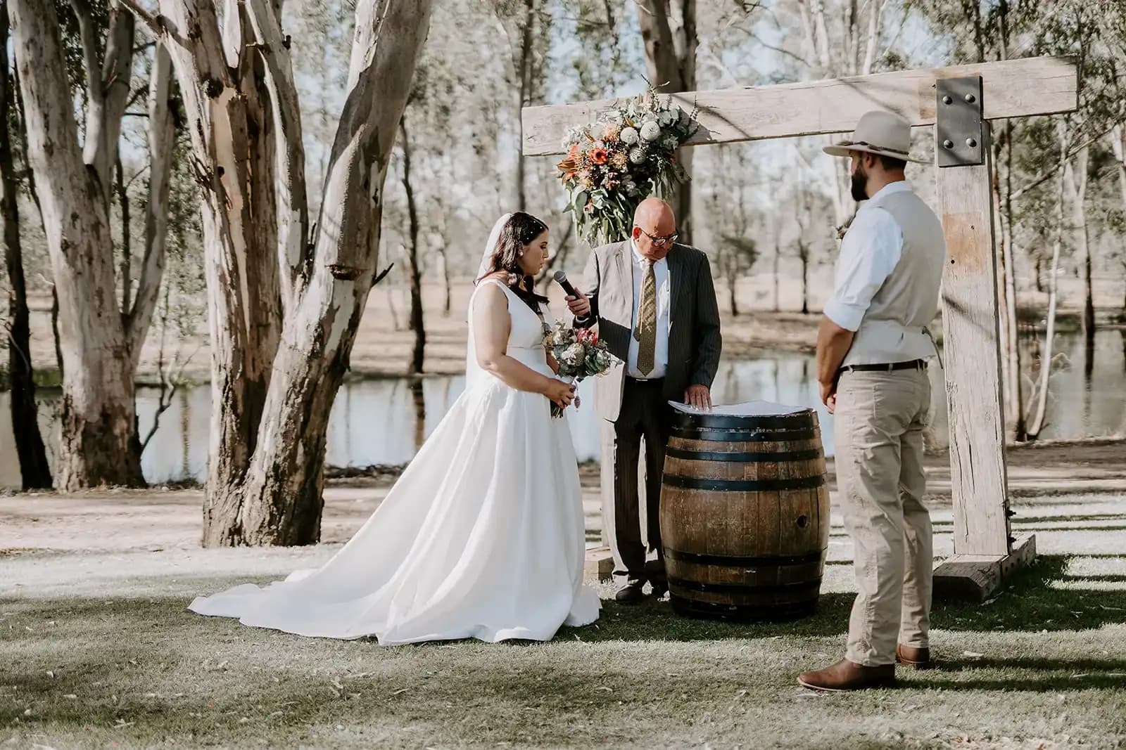 Wedding ceremony at the red gum arbour, with the lagoon behind