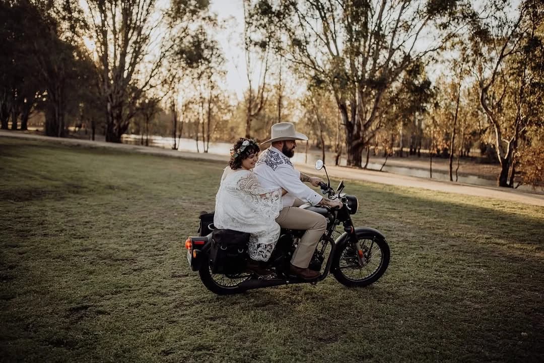 A wedding couple enjoying the lawns at The Paddock